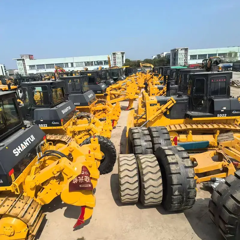 Used bulldozers and graders in an earthmoving equipment area